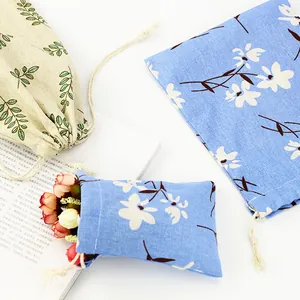 Three floral print cotton linen drawstring pouches for daily storage and travel