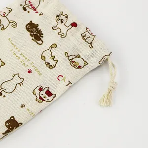 Linen drawstring pouch with cute cartoon cat pattern and English text on white background