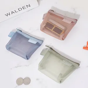 Three minimalist mesh zipper pouches in pink, blue, and green colors