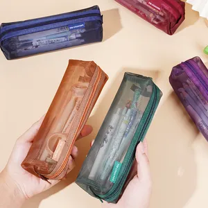 Minimalist vintage color large capacity transparent mesh pencil cases held in hands