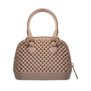 Stylish mini PVC jelly shell handbag with textured bubble design and top handle in dusty rose