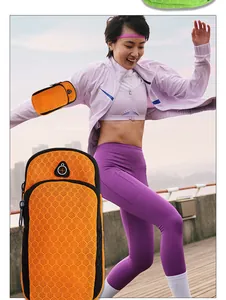 Action shot of an orange mesh running phone armband for workout, gym, and fitness