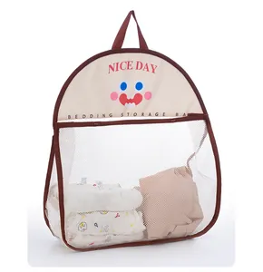 Detail view of hanging mesh storage bag with cute cartoon face and clothes inside