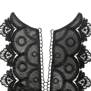 Detailed view of black water-soluble lace collar with leather embroidery pattern
