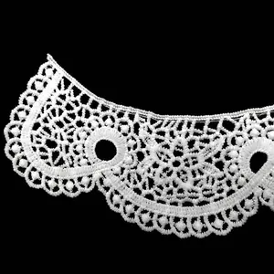 Close-up of white water-soluble lace collar with hollow embroidered milk silk patterns