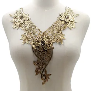 Macro view of golden water-soluble lace floral embroidery applique on a mannequin