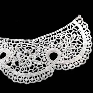 Close-up of white water-soluble lace collar with 3D hollow floral embroidery detail