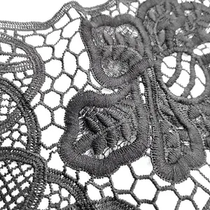 Macro detail of black water-soluble milk silk lace with exquisite 3D embroidery floral pattern