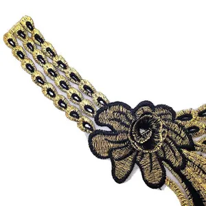 Close-up detail of gold and black embroidered lace floral collar patch for DIY sewing