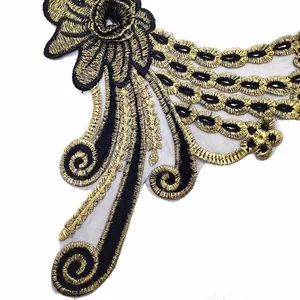 Detailed close-up of intricate gold and black floral embroidery on mesh lace collar applique