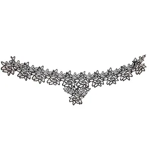 Detailed macro view of two-tone floral water-soluble lace applique with hollow embroidery.