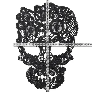 Detailed view of large black skull lace embroidery patch showing dimensions with rulers