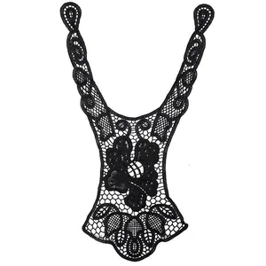 Macro view of black water-soluble lace collar with intricate floral embroidery details