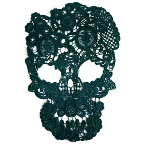 Close-up detail of dark green skull milk silk embroidered water-soluble lace patch