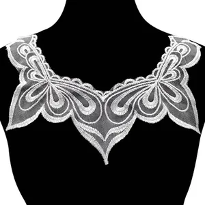 Detailed view of white water-soluble lace collar with delicate mesh embroidery pattern.
