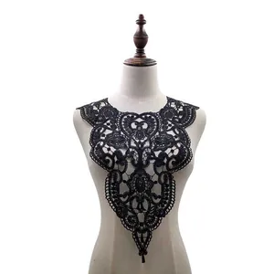 Detailed shot of black water-soluble lace collar appliqué on mannequin torso