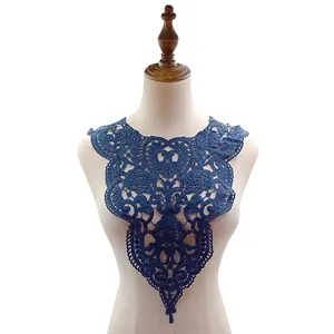 Detailed close-up showing navy blue 3D embroidery patterns on a lace collar applique