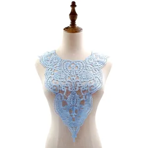 Close-up of delicate light blue water-soluble lace collar with intricate heart embroidery