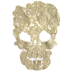 Intricate skull-shaped water-soluble lace applique with milk silk embroidery detail