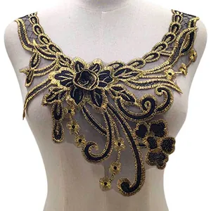 Detailed view of black and gold embroidered lace floral collar applique for DIY sewing