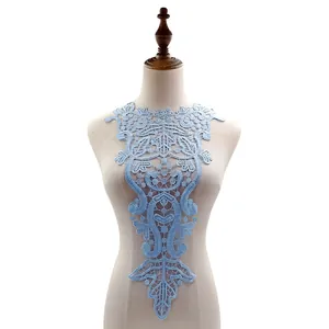 Light blue water-soluble lace collar patch on dress form for DIY sewing projects