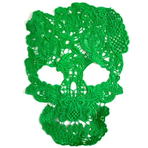 Detailed view of green skull-shaped milk silk embroidered lace patch for DIY crafts