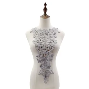Detailed view of elegant grey water-soluble lace collar applique displayed on a white mannequin