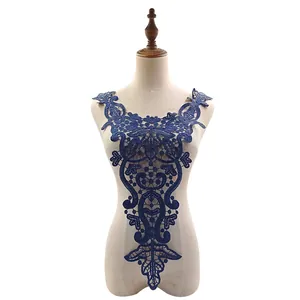 Detailed view of a navy blue water-soluble lace collar applique with hollow-out embroidery.