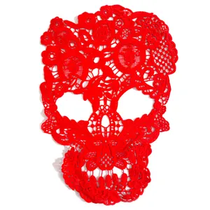 Detailed macro view of a red milk silk water-soluble lace skull embroidery craft patch