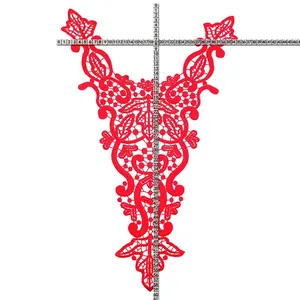 Detailed view of red water-soluble lace collar embroidery applique with a measuring ruler