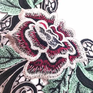 Detail view of heavy floral embroidery with 3D hollow water-soluble lace patterns