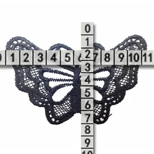 Detailed view of black butterfly lace embroidery patch with size measurement reference