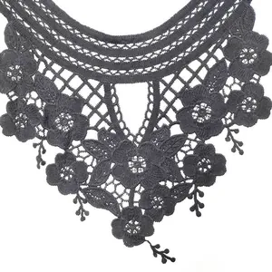 Close-up detail of black water-soluble lace collar with 3D hollow floral embroidery