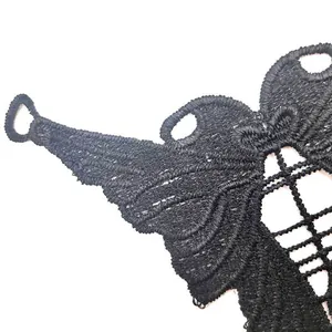 Close-up of black water-soluble lace embroidery with butterfly wing hollow pattern