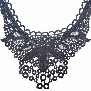 Detail shot of black water-soluble lace false collar with hollow embroidery pattern.