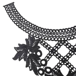 Close-up of black water-soluble lace collar with intricate floral embroidery detail