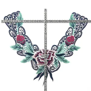Close-up of floral embroidered fake collar applique with measurement rulers