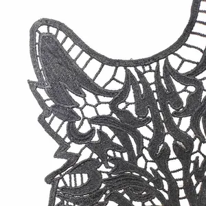 Detailed close-up of intricate black 3D hollow water-soluble lace embroidery texture