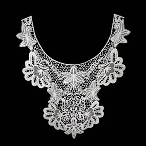 Detailed view of white water-soluble lace floral embroidery for neckline applique