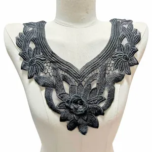 Black floral water-soluble lace collar applique with intricate embroidery displayed on mannequin