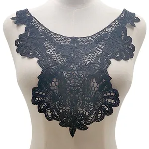 Detailed close-up view of black hollow-out floral lace embroidery collar on mannequin.