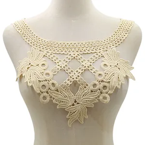 Detailed cream water-soluble lace collar embroidery displayed on a neutral mannequin