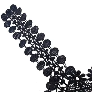 Close-up detail of black water-soluble milk silk embroidered lace collar floral trim