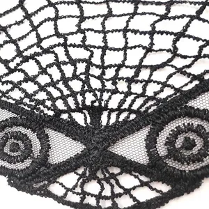 Close-up of black lace embroidery fan-shaped collar with intricate mesh detailing