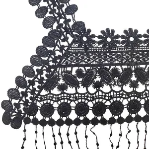Detailed close-up of black hollow water-soluble lace collar with floral embroidery