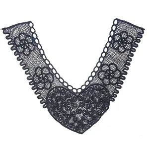 Detailed macro view of black V-neck lace collar with intricate floral heart embroidery