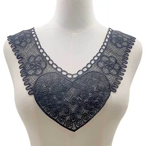 Detail showing intricate black heart-shaped water-soluble lace embroidery for DIY sewing