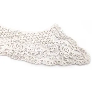 Macro view of white water-soluble cotton lace collar with exquisite floral embroidery texture