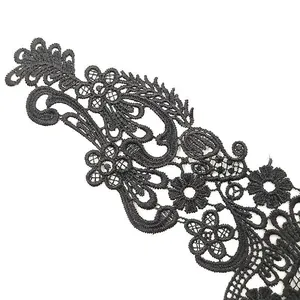 Detailed macro shot of black water-soluble lace floral embroidery for DIY sewing projects