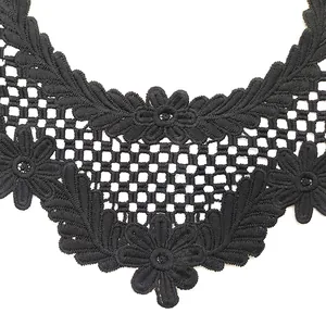 Close-up detail of black water-soluble lace collar with floral embroidery for DIY sewing